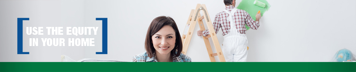 Woman smiling and man painting wall with text saying, "Use the equity in your home"